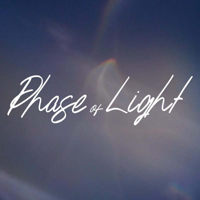 Phase of Light script text on clouds